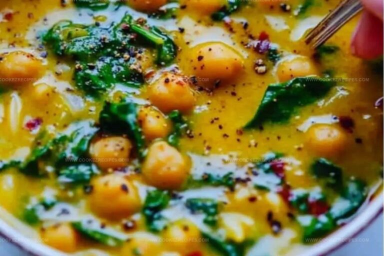Golden Turmeric Soup with Chickpeas, Orzo, and Spinach Recipe