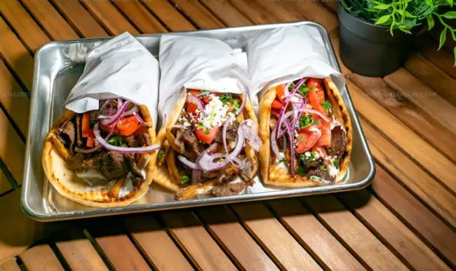 How Does Greek Grilling Differ From Braising or Oven Baking?